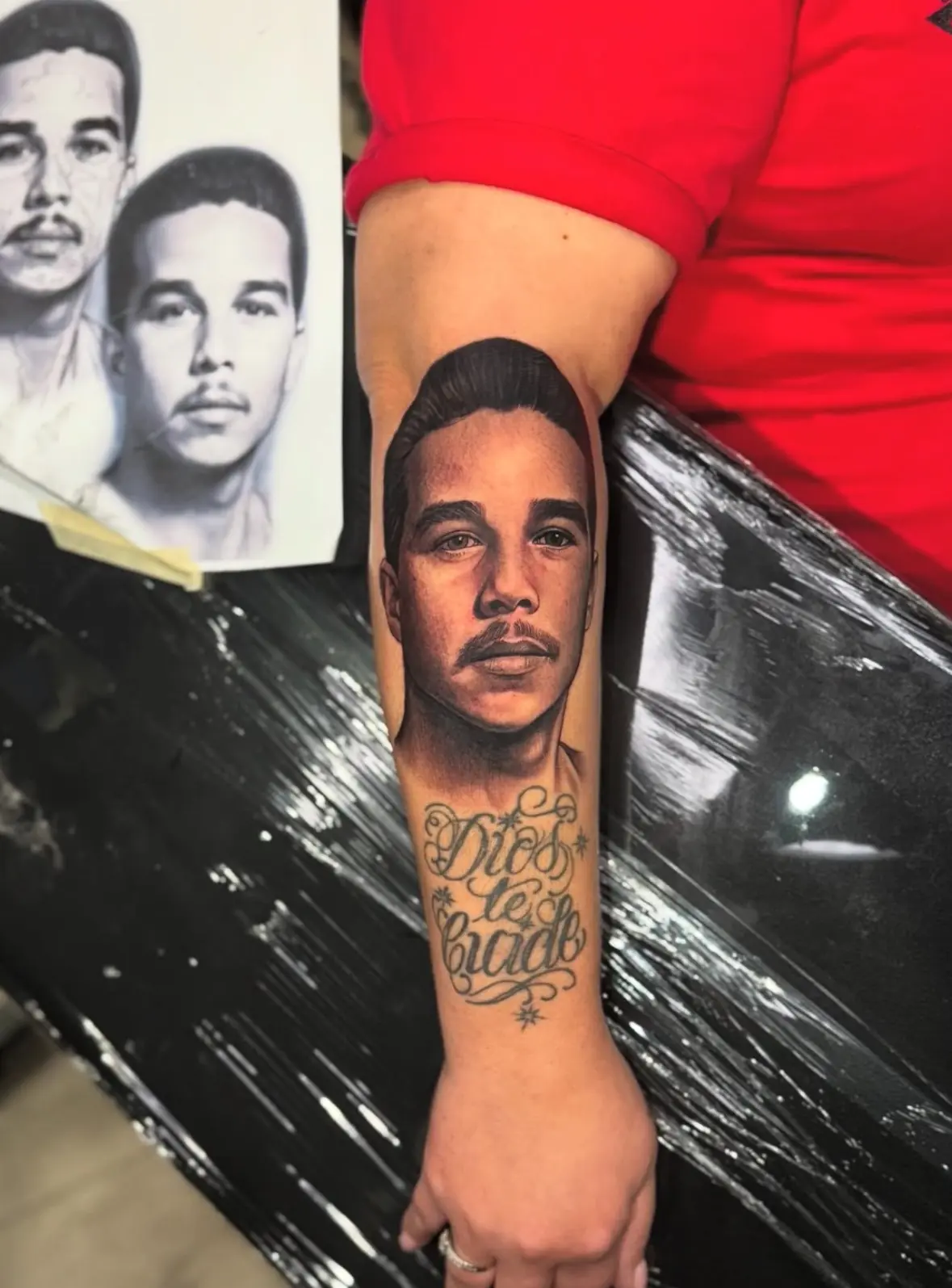 Realistic portrait tattoo on a forearm