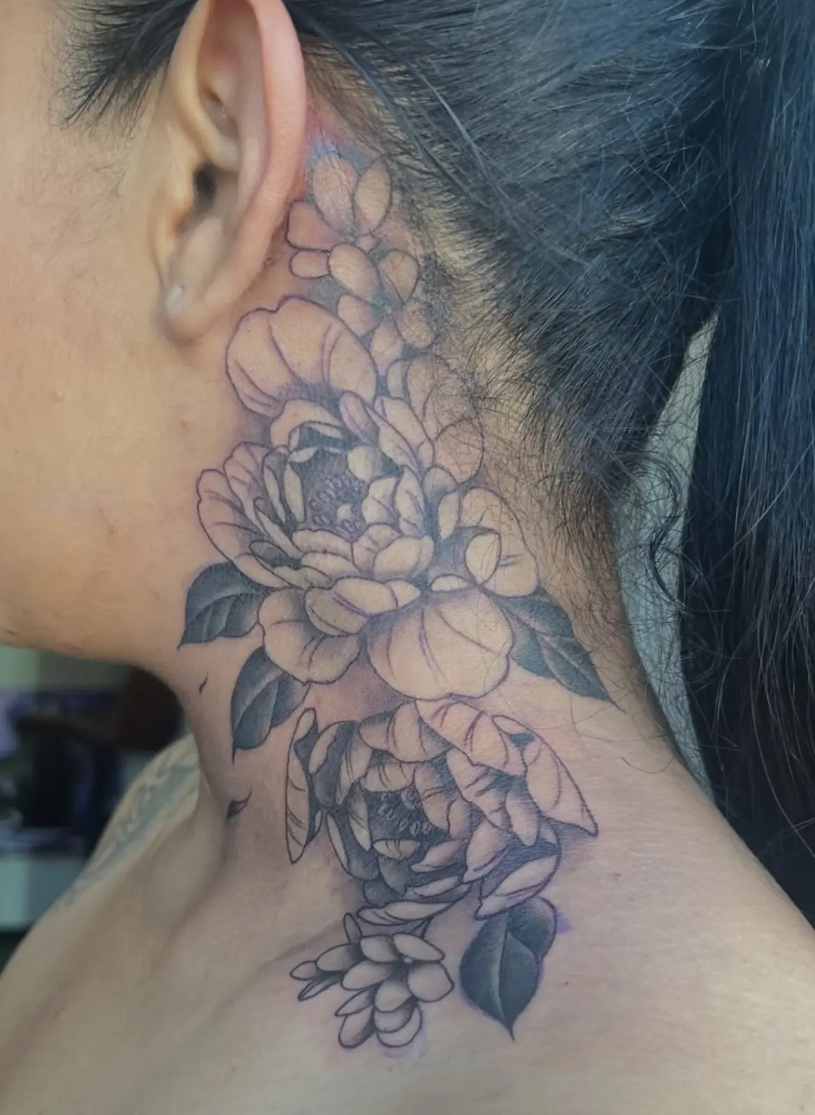 Floral neck tattoo from Only 4Ever Tattoo Studio